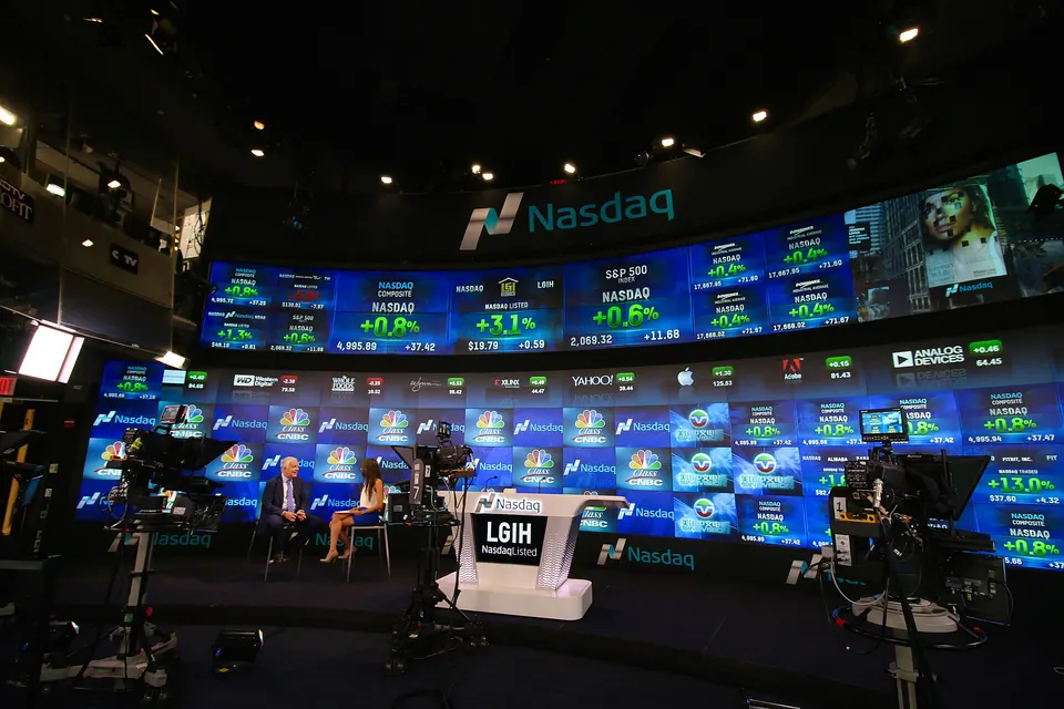 Contextual file photo: the Nasdaq MarketSite broadcast studio in New York, with a 2015 market display