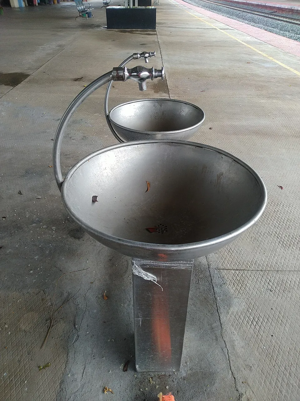 Water tap over a round sink; contextual file photo.